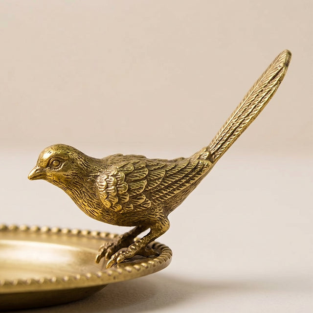 Closeup textured bird figurine on tray