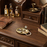 Decorative metal tray on vintage wood side dresser