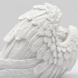 Detailed carved angel wing closeup