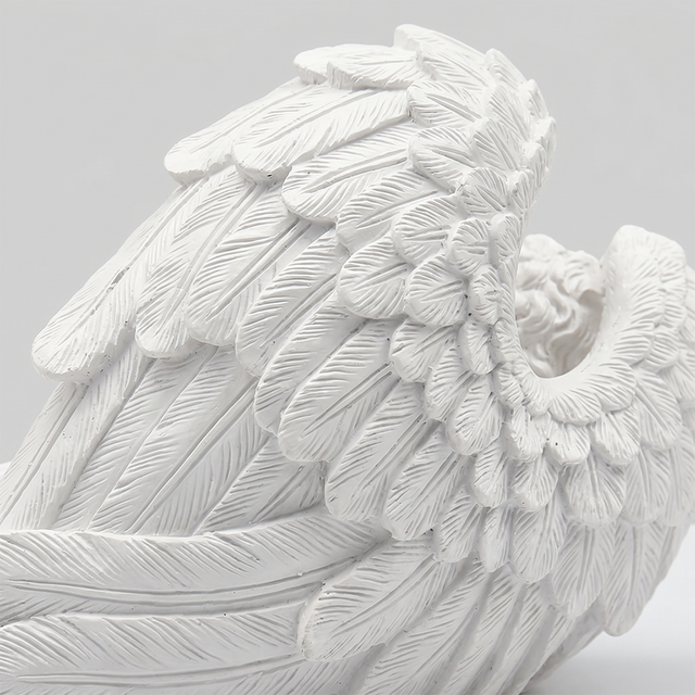 Detailed carved angel wing closeup