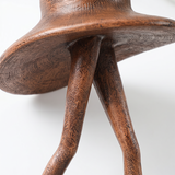 Detailed crossed legs hat statue shot