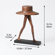Dimension marked brown walking character sculpture