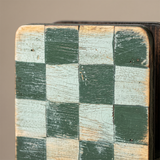 Distressed checkerboard wood panel
