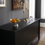 Elegant bowl on black console table
