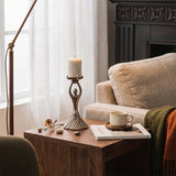 Figure candle holder on living side table