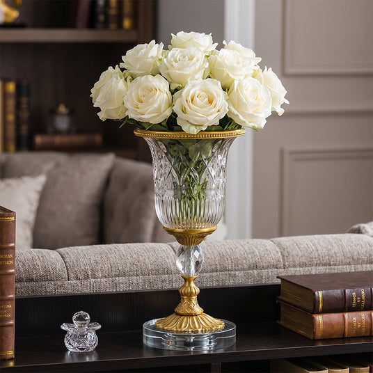 Flower filled glass vase on living side table