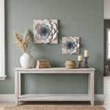 Flower wall art behind console
