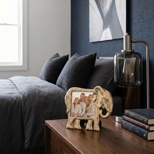 Frame placed on bedside wood table