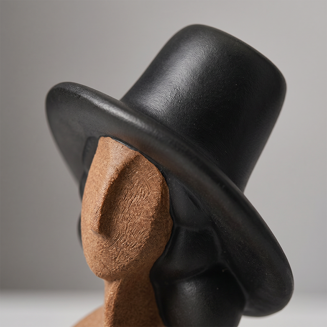 Front closeup wide brim hat woman sculpture