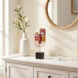 Geometric Face Sculpture On White Console