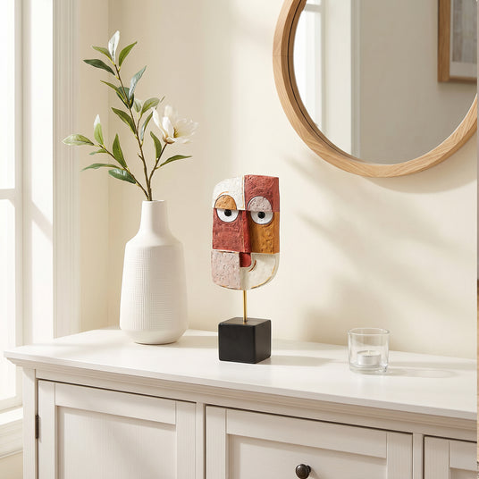 Geometric Face Sculpture On White Console