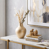 Gilded cat family ornament on marble entry console