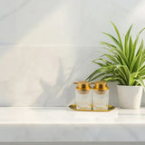 Glass Bathroom Dispenser Set on the table