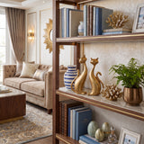 Gold Cat Sculptures On Display Shelf