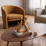 Gold Cat Sculptures On Wooden Table