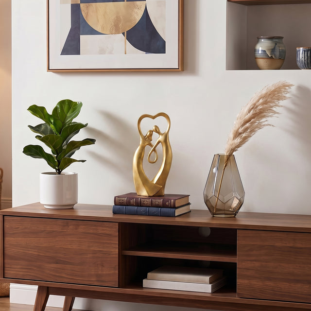 Gold Couple Sculpture On Wooden Cabinet