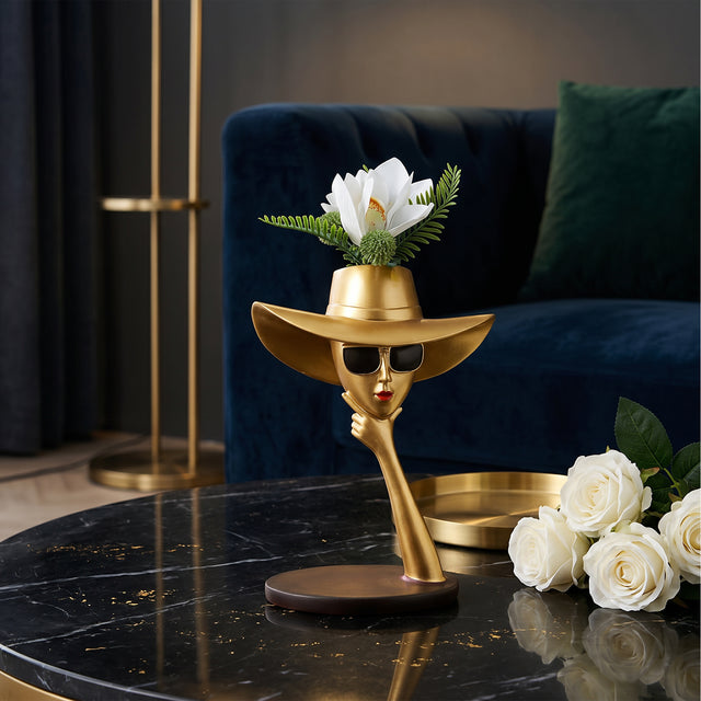 Gold Face Vase On Black Marble Table