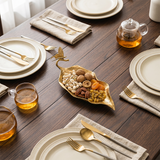 Gold leaf platter on dark wood dining table