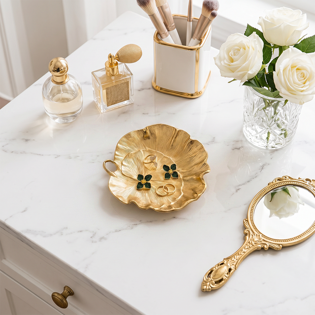 Gold tray on marble bathroom vanity