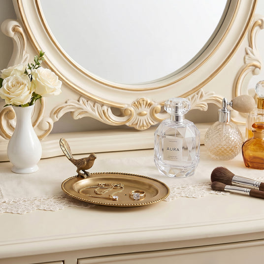 Golden bird plate on white luxury dresser