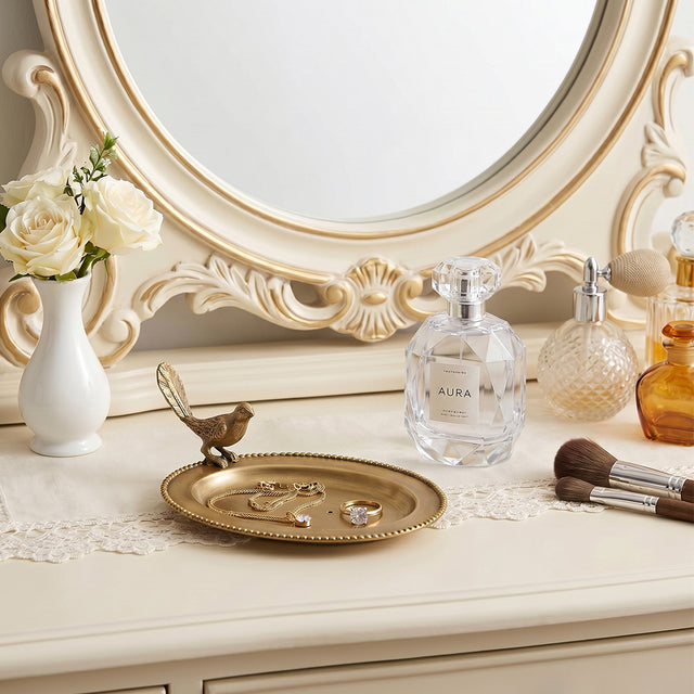 Golden bird plate on white luxury dresser