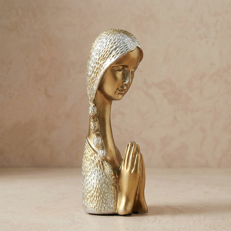 Golden praying woman figurine