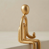 Golden sitting figurine