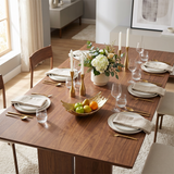 Golden splash bowl on  dark wood dining table