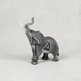 Grey carved elephant resin figurine with upward trunk