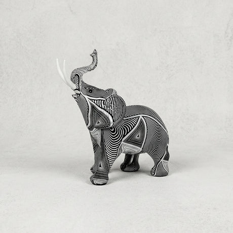 Grey carved elephant resin figurine with upward trunk