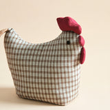 Grey check chicken figurine closeup
