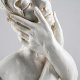 Hand cheek white bust detail shot
