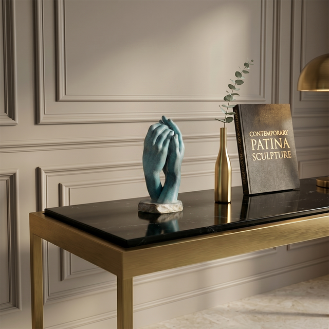 Hands figurine on black glass coffee table