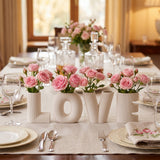 LOVE vases on dining table with pink roses 