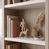 Man And Dog Sculpture On Bookshelf