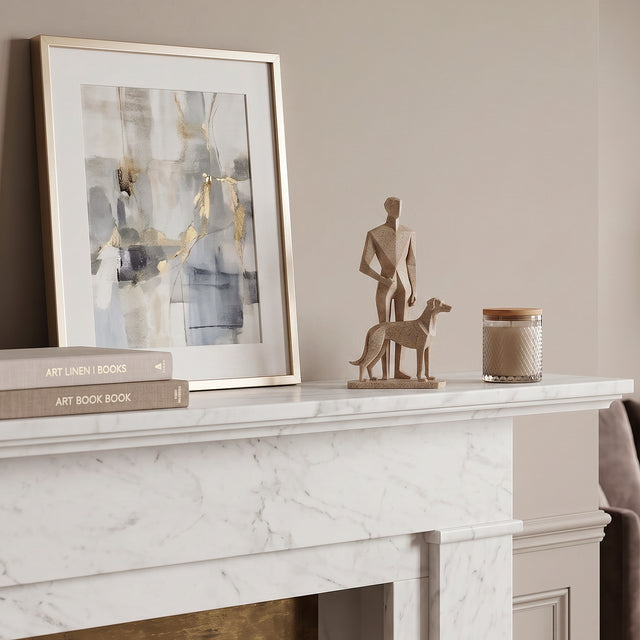 Man And Dog Sculpture On Marble Mantel