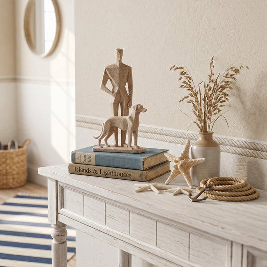 Man And Dog Sculpture On White Console
