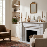 Marble fireplace minimal sculptures cozy living room