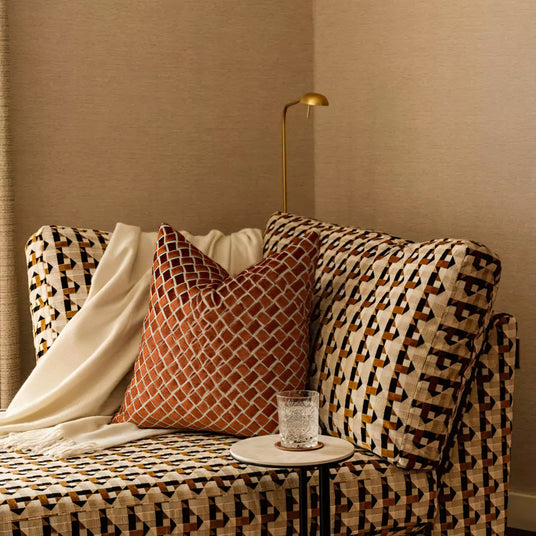 Modern Luxury Minimalist Hand-Woven Orange-Brown Cushion Pillow on the Bed