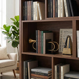 Musical bookend set inside open living bookshelf