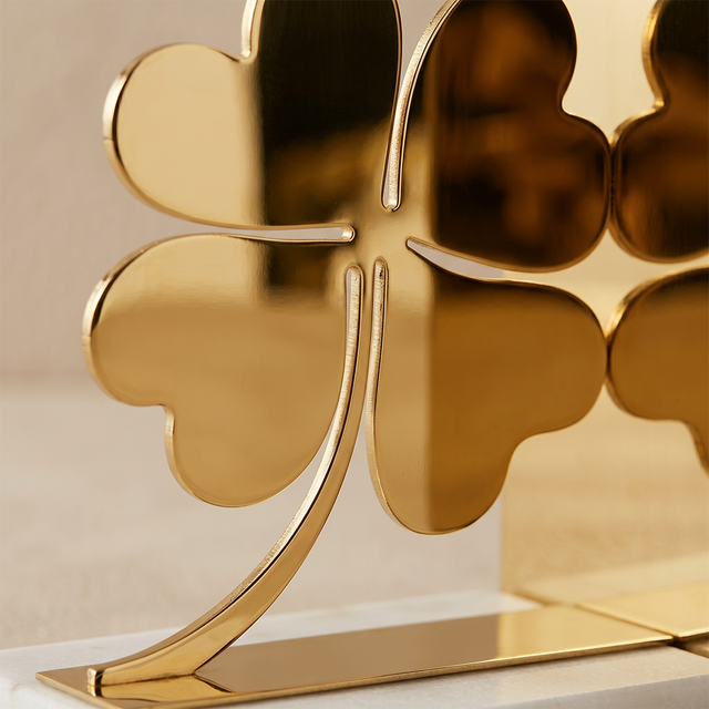 Polished metal clover bookends shot
