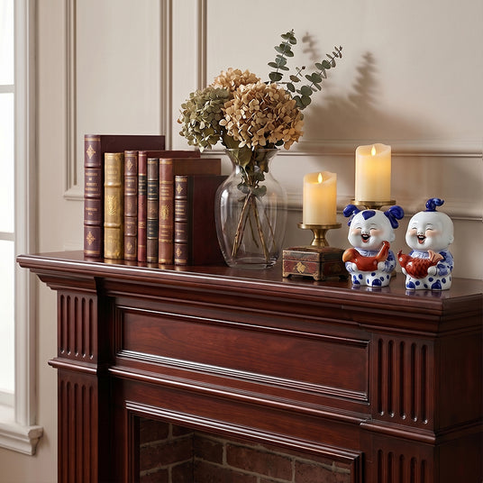 Porcelain child pair on classic fireplace mantel