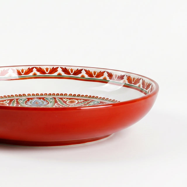 Red glazed decorative ceramic plate