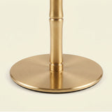 Round flat brass base closeup view