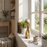 Sculpture placedon bright window sill