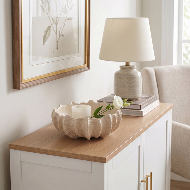 Shell Bowl With Candle On Cabinet