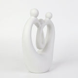 Side View Of White Family Sculpture