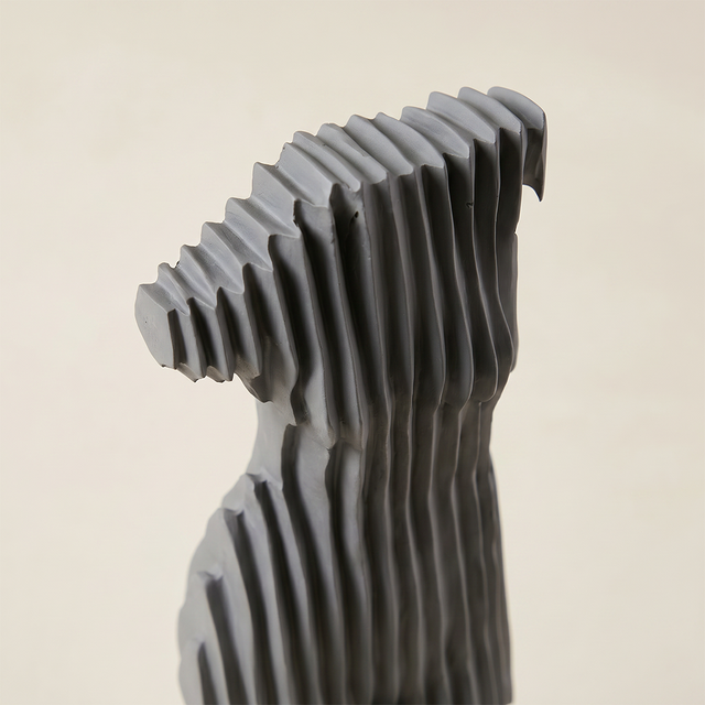 Side closeup striped torso figurine