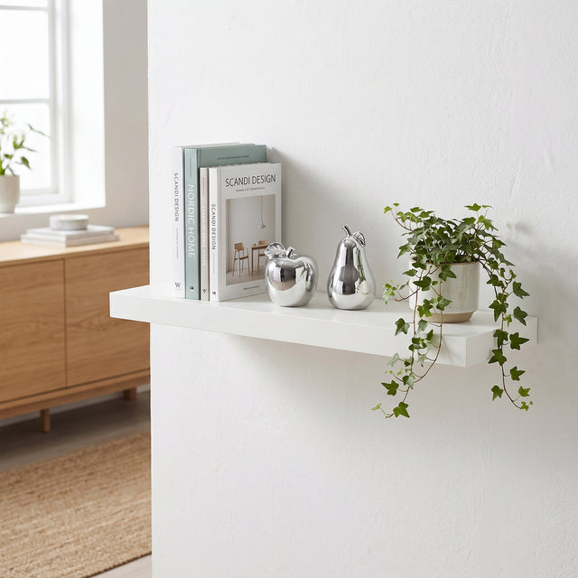 Silver Fruit Decor On White Shelf
