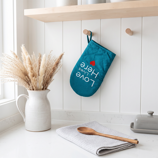 Teal oven mitt kitchen scene
